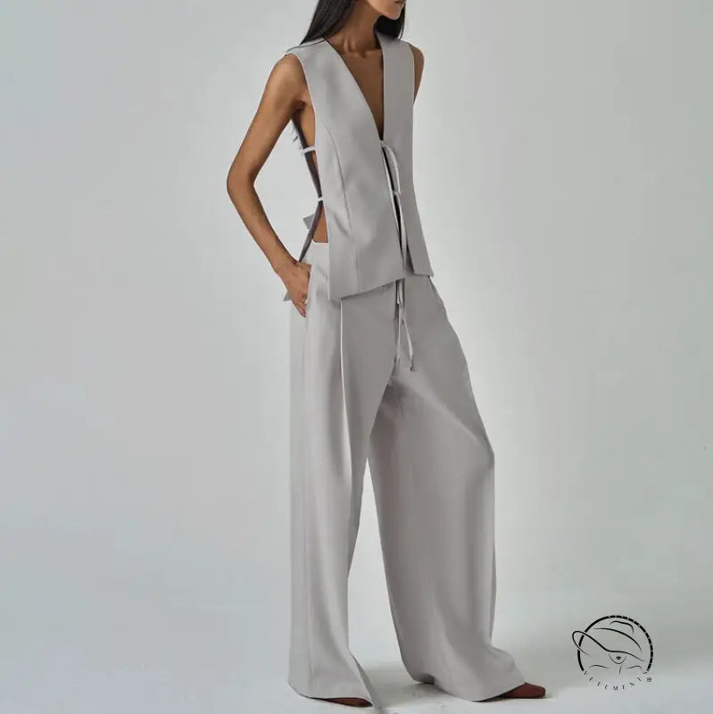 Sleek light gray long sleeve fashion vest with v-neck and wide-leg trousers