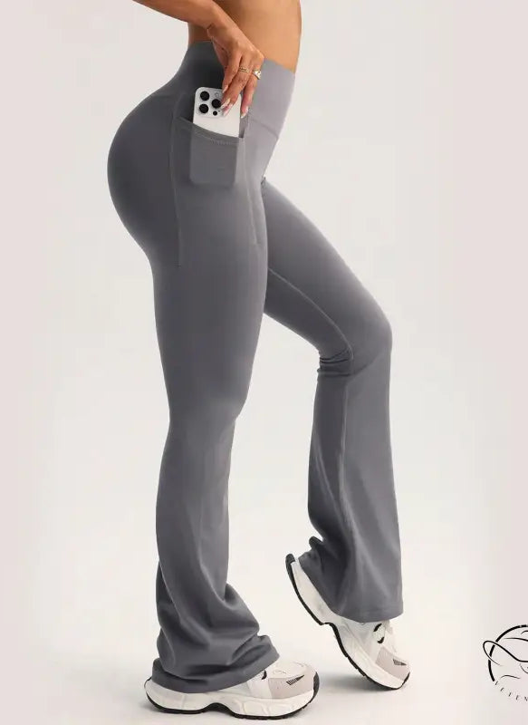Gray high-waisted flared langry yoga pants with side phone pocket