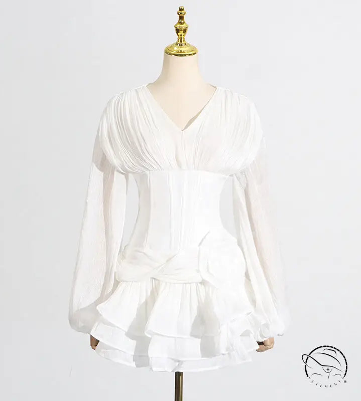 White ruffled langry fashion blouse with long sleeves and pleated bodice