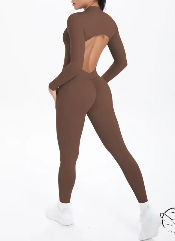 Sleek long sleeve brown yoga jumpsuit with back cutout and zipper