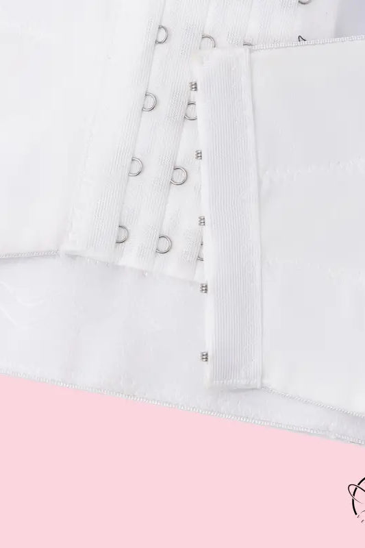 White lace-up langry corset top in bridal fashion with silver eyelets