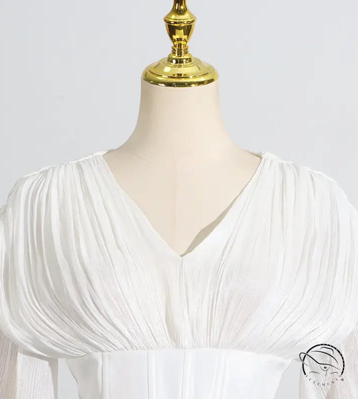 White langry fashion blouse with puff sleeves and v-neck design