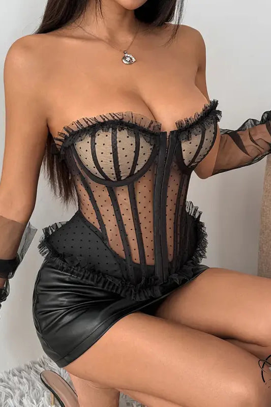 Polka dot lace corset with black leather fringed mini skirt overlay