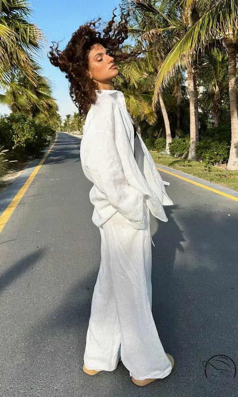 Woman in white linen cotton shirt trousers casual set