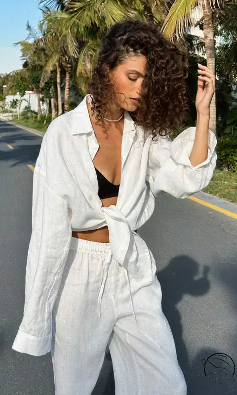 Woman in white linen cotton shirt trousers casual fashion set