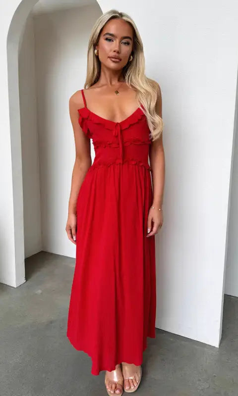 Elegant loose dress: red spaghetti-strap maxi with fitted bodice and flowing skirt