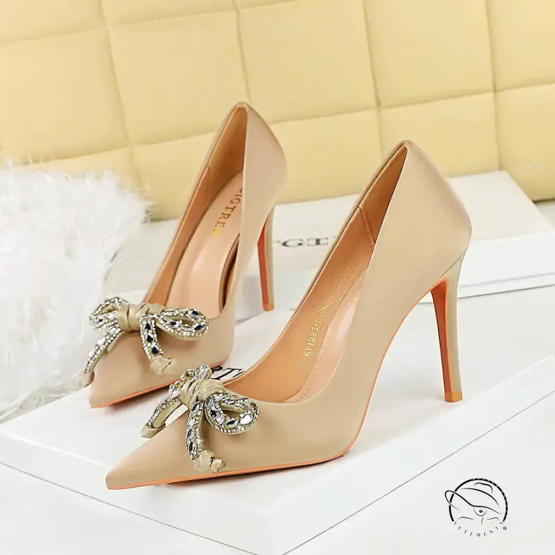 Langry fashion nude satin stilettos with gold bow and rhinestone details