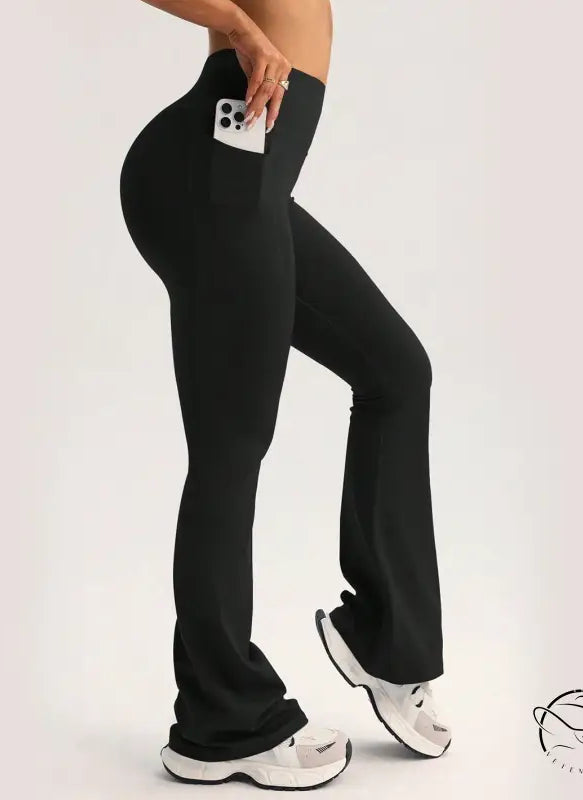 Black high-waisted flare yoga pants with side pocket, langry fashion ملابس