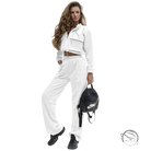 Woman in elegant Vetements suit with white tracksuit and black backpack