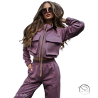 Woman in elegant vetements suit with long sleeve mauve tracksuit