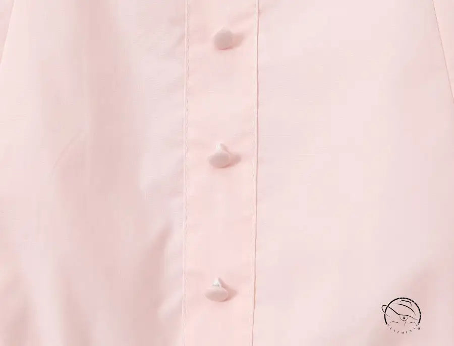 Enchanting steel bracket short dress in pale pink fabric with subtle buttons