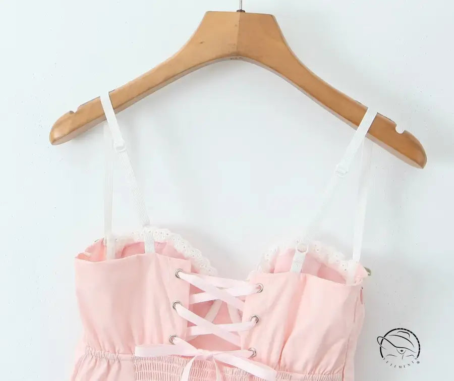 Enchanting steel bracket short dress in pink and white corset top with lace-up detail on hanger