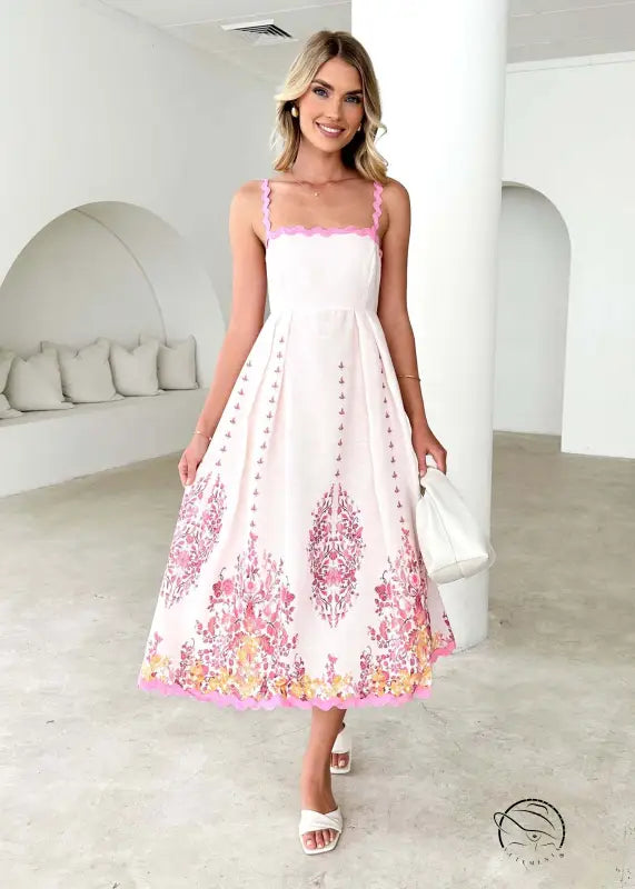 Attractive backless dress in white with pink floral embroidery