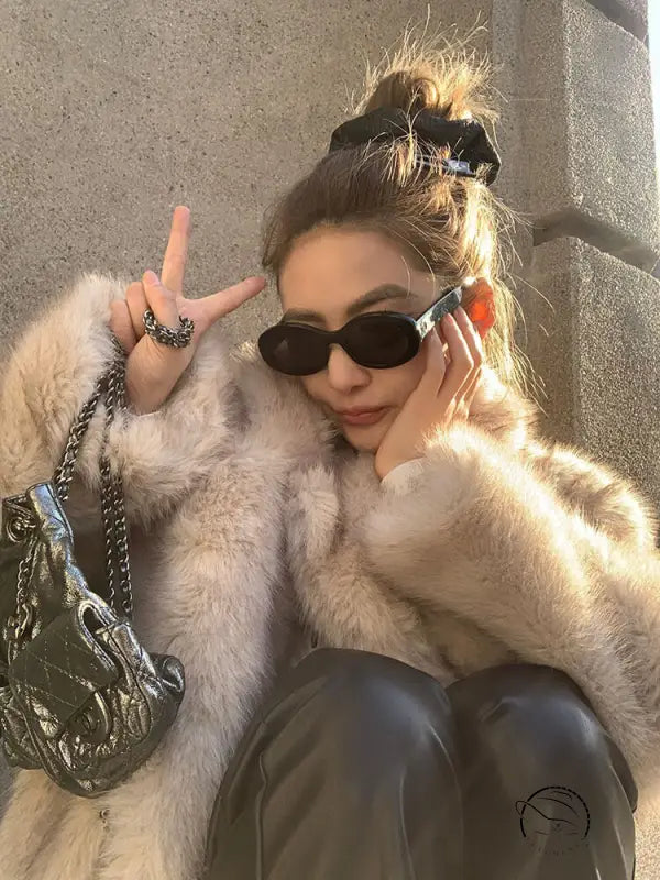 Cream faux fur jacket with sunglasses, silver bag, Langry fashion