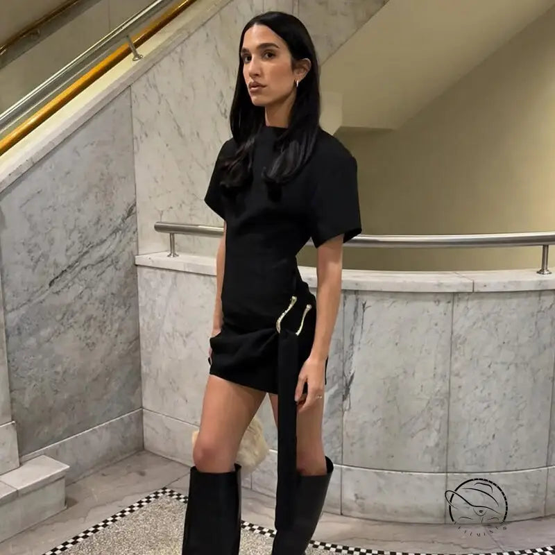 Woman in black short dress, mini style with boots, langry fashion