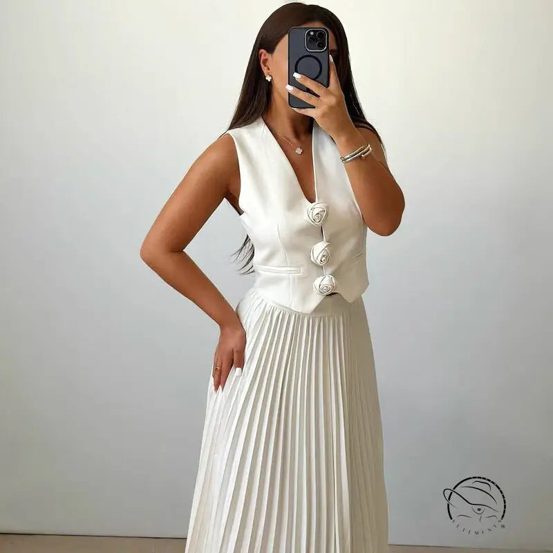 Langry fashion woman in white sleeveless vest and pleated skirt set