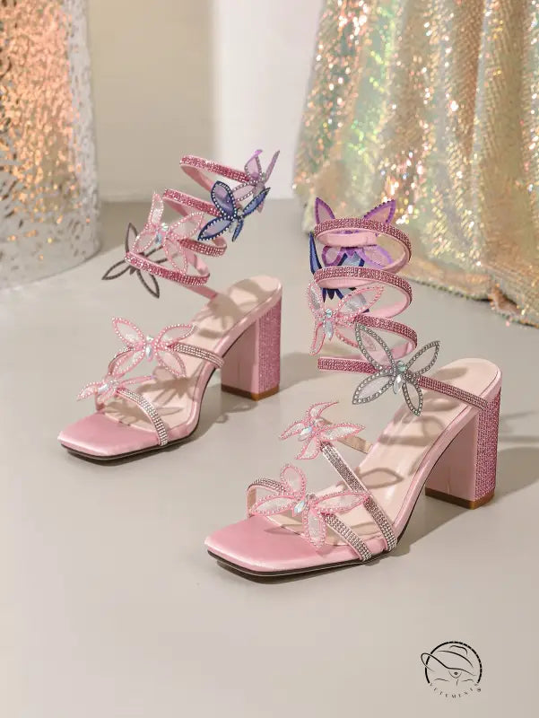 Pink glittery langry fashion stiletto heels with rhinestone bow and butterfly accents