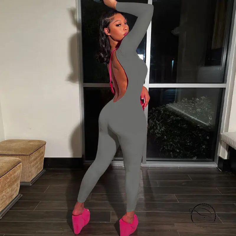 Gray backless slim fit jumpsuit with pink shoes