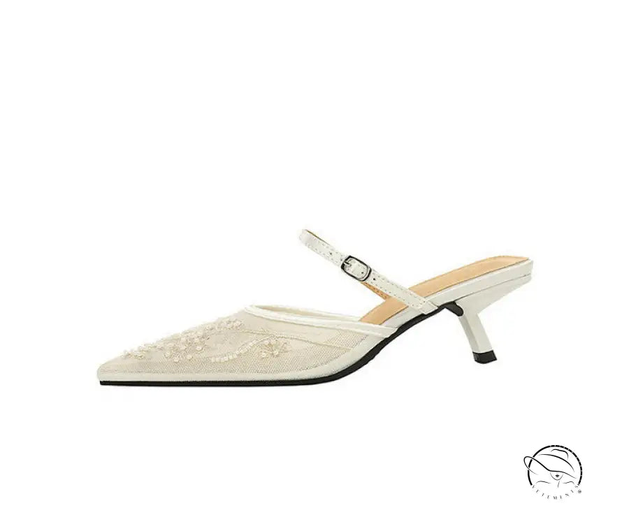 Cream-colored langry fashion kitten heel mule with floral embroidery and ankle strap