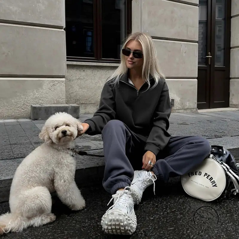 Woman in gray half zipper autumn winter fleece lined sweatsuit with white sneakers