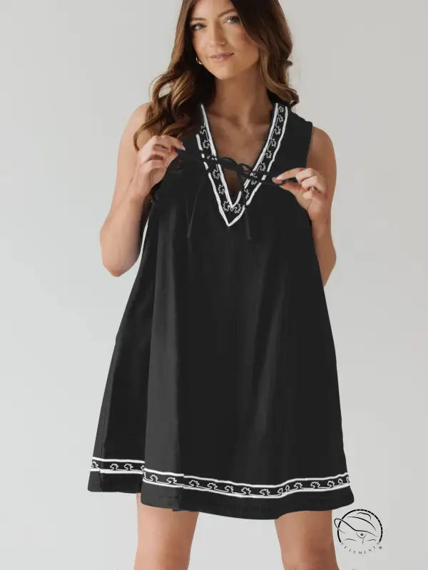 Beautiful embroidered vest denim dress in black with white trim