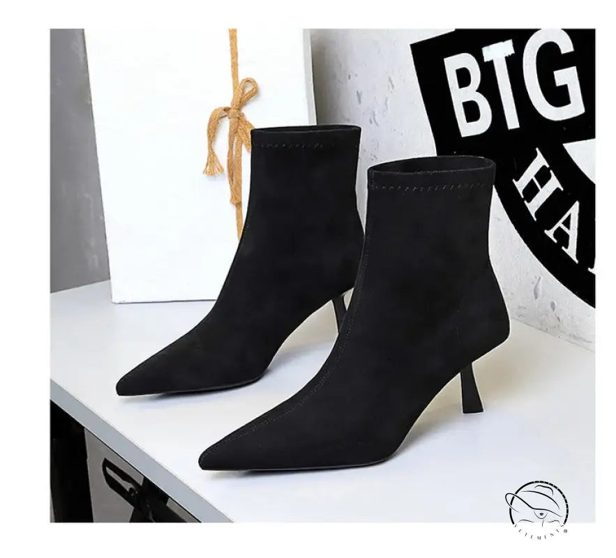 Black suede ankle fashion boots with pointed toes and low heels